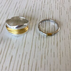 2 silver rings with gold accents size 8